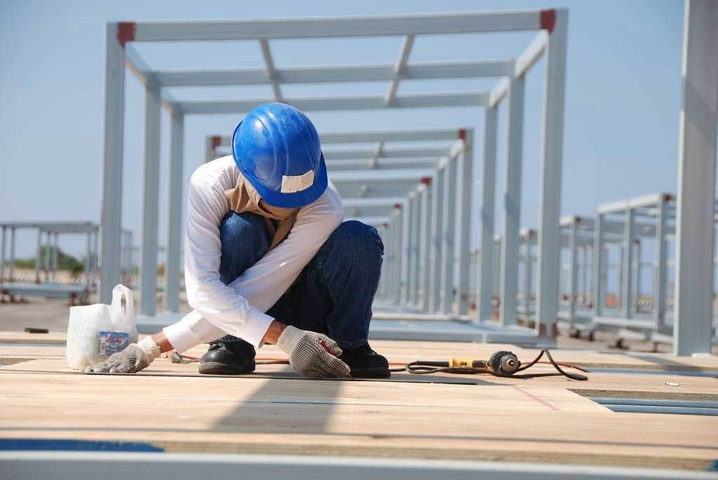 Hard hat, Workwear, Helmet, Tradesman, Sky, Wood, Headgear, Engineer, Floor