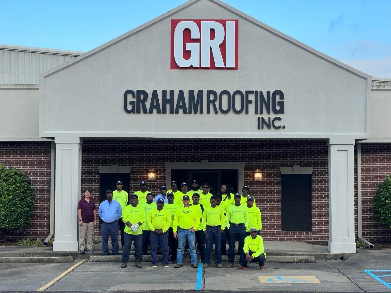 High-visibility clothing, Jeans, Plant, Property, Workwear, Sky, Fixture, Asphalt, Wheel, Building