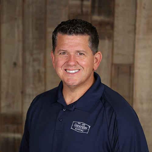 Man smiling in Great Way Roofing polo.