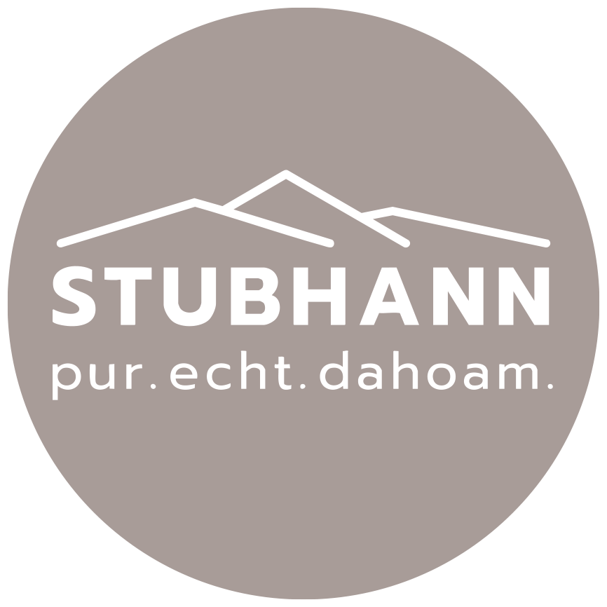 STUBHANN logo: white mountain outlines, text "STUBHANN pur. echt. dahoam." in a grey circle.