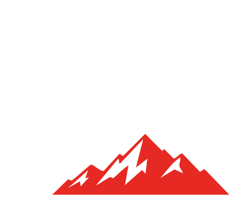 White silhouette of a mountain biker jumping over red peaks, with speed lines, on a green background.