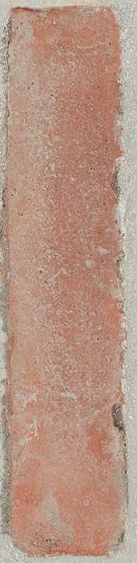 Textured red brick with white residue and light mortar.