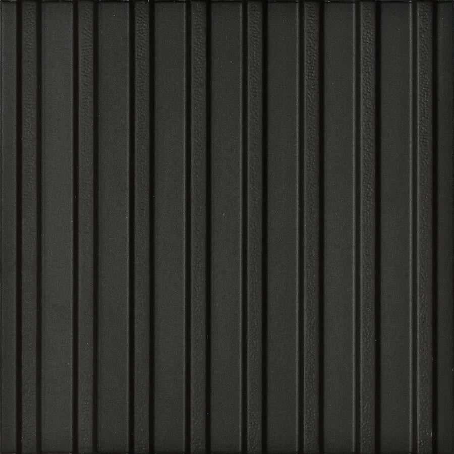 Dark grey textured surface with vertical parallel ridges.