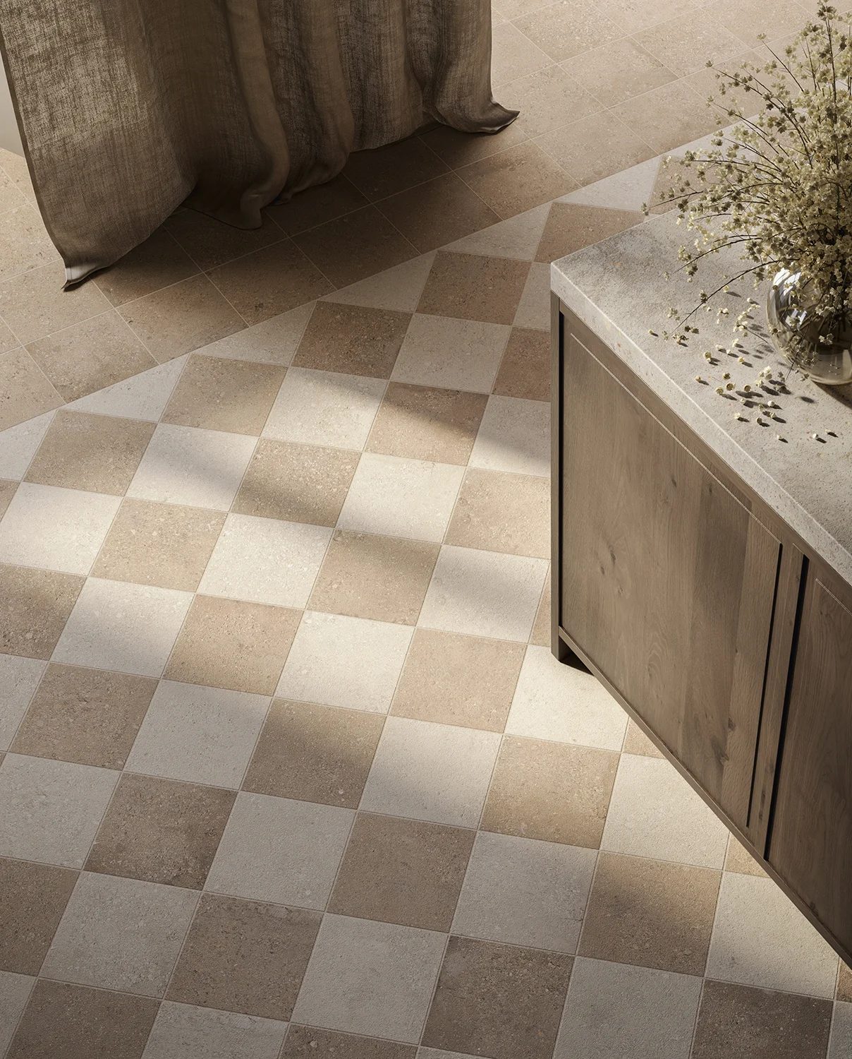 Beige and brown checkerboard tiled floor transitioning to solid tiles, with a curtain and cabinet.