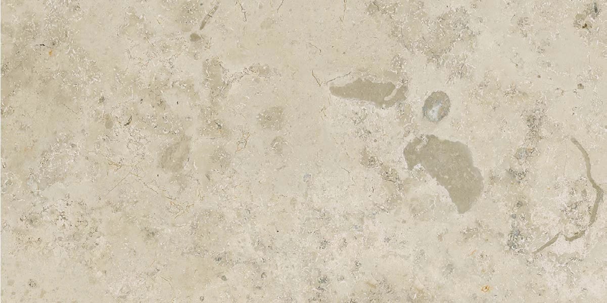 Light beige stone texture with natural mottling and fine cracks.