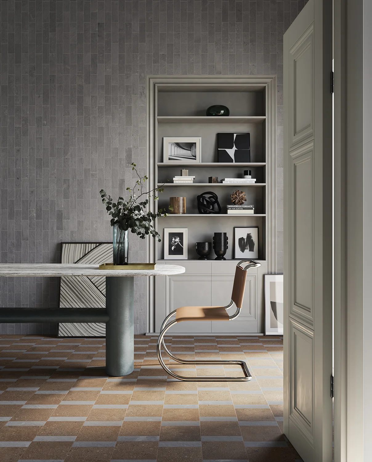 Modern room with grey tiled wall, built-in bookshelf, modern table, chair, and patterned floor.