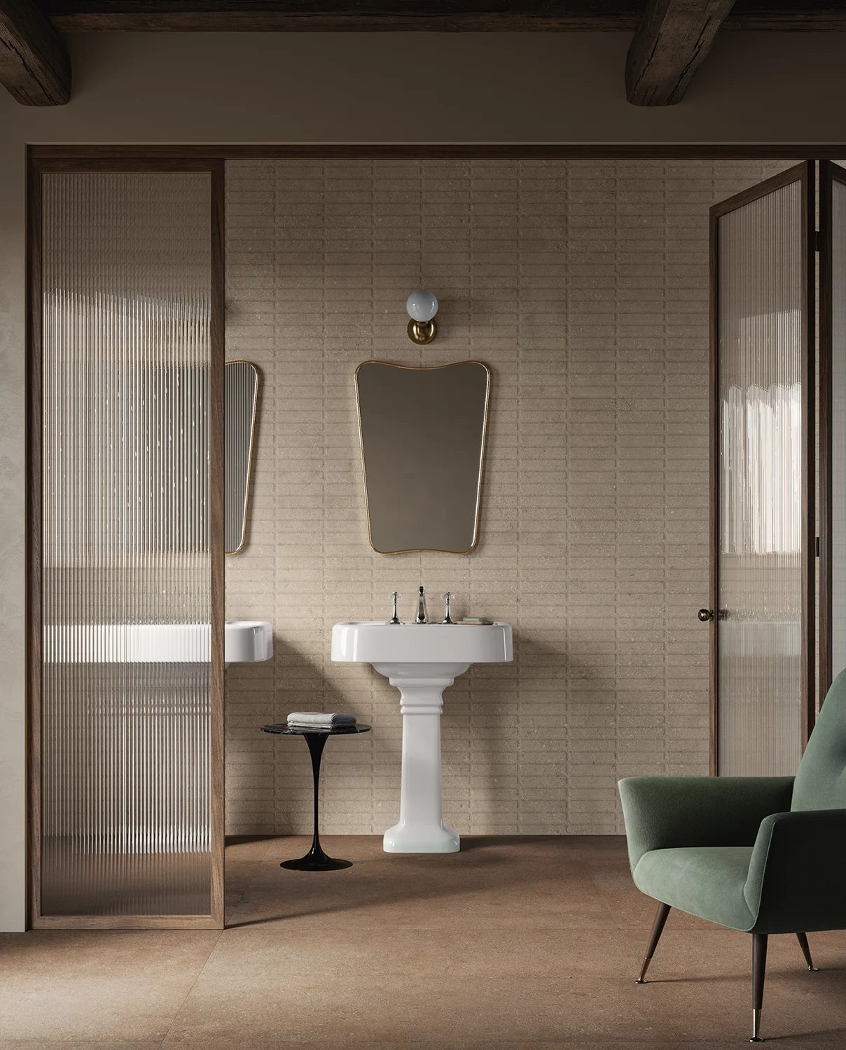 Rustic bathroom with pedestal sink, beige textured walls, fluted glass doors, and green armchair.