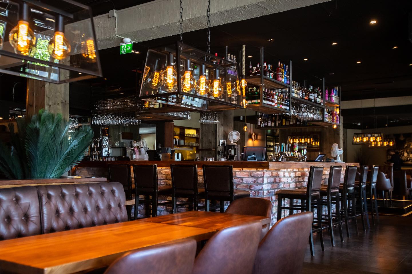 Drinking establishment, Interior design, Furniture, Barware, Couch, Table, Bottle, Building, Chair
