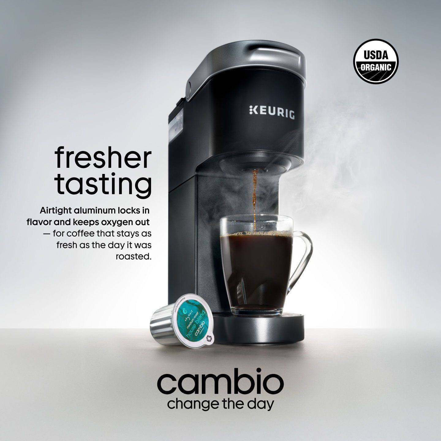 A Keurig coffee machine brews into a mug, with a coffee pod and text highlighting "fresher tasting" coffee.