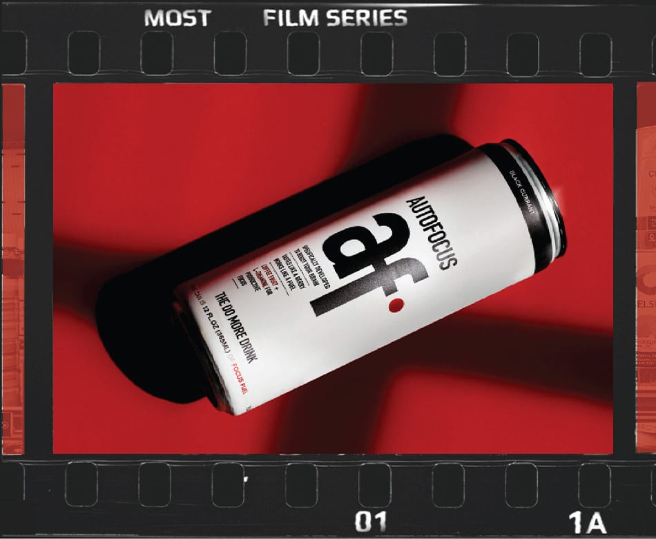 White 'AUTOFOCUS af' black currant can on red, in a film strip frame.