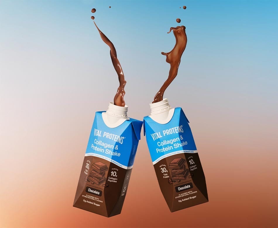 Two Vital Proteins chocolate collagen & protein shakes with chocolate splashing out from their tops.