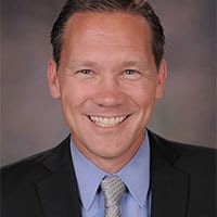 Forehead, Smile, Head, Chin, Eyebrow, Tie, Suit, Collar