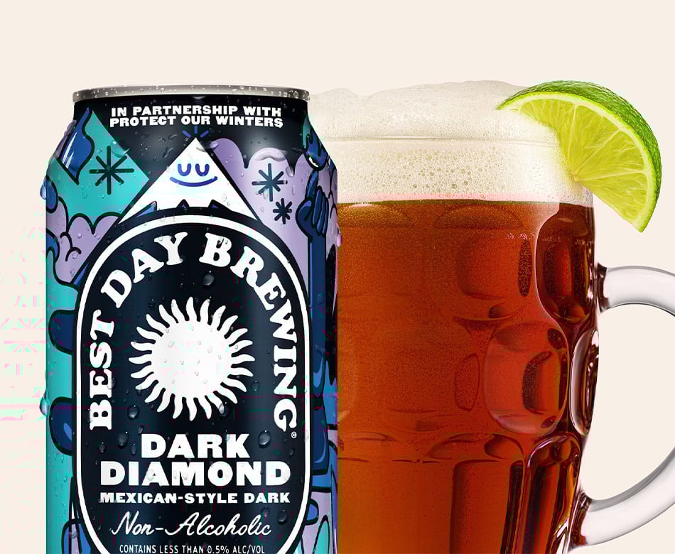 Best Day Brewing non-alcoholic Dark Diamond beer can & mug with lime.
