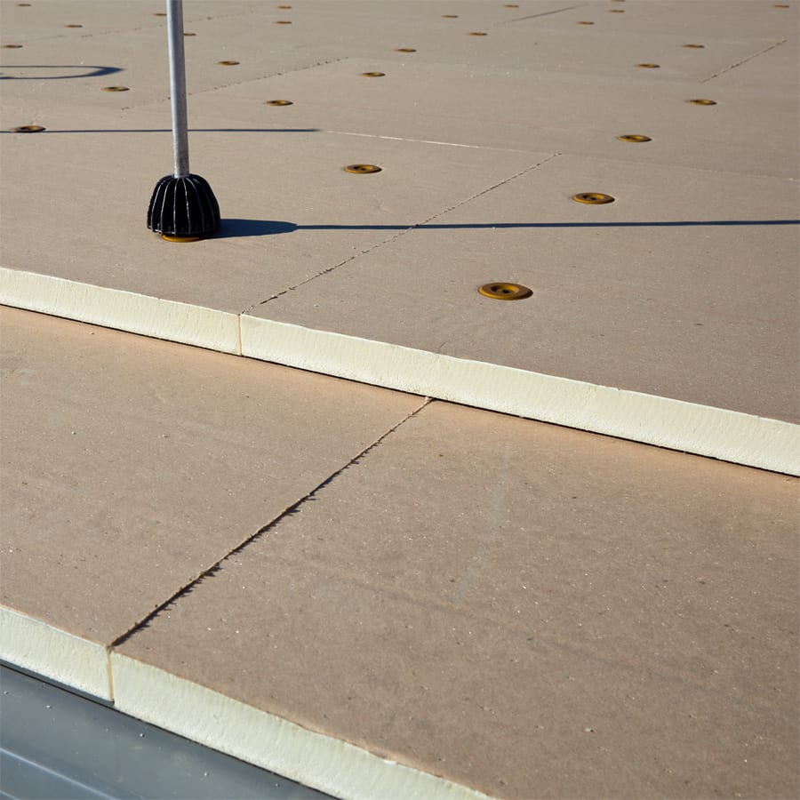 Close up of an attachment method of fasteners in coverboard on a commercial roof.