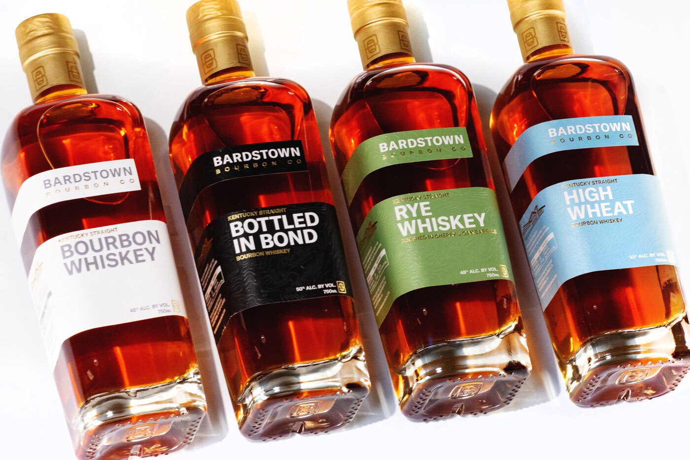 Four bottles of Bardstown Bourbon Co. whiskey: Bourbon, Bottled in Bond, Rye, and High Wheat.