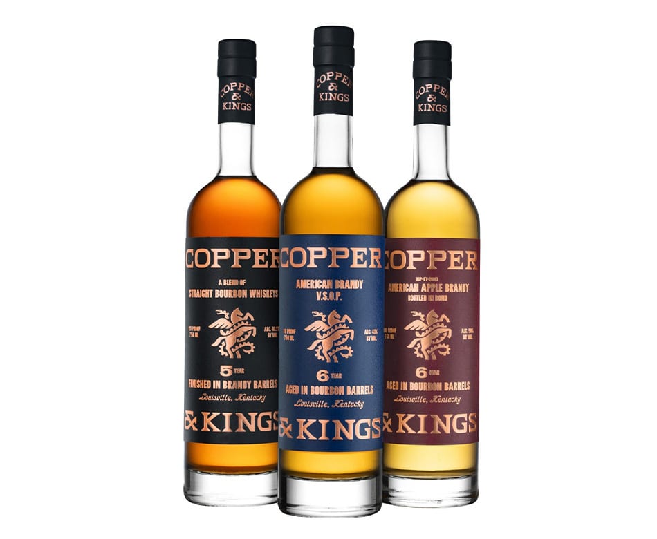 Three Copper & Kings spirit bottles: Straight Bourbon Whiskey, American Brandy, and American Apple Brandy.