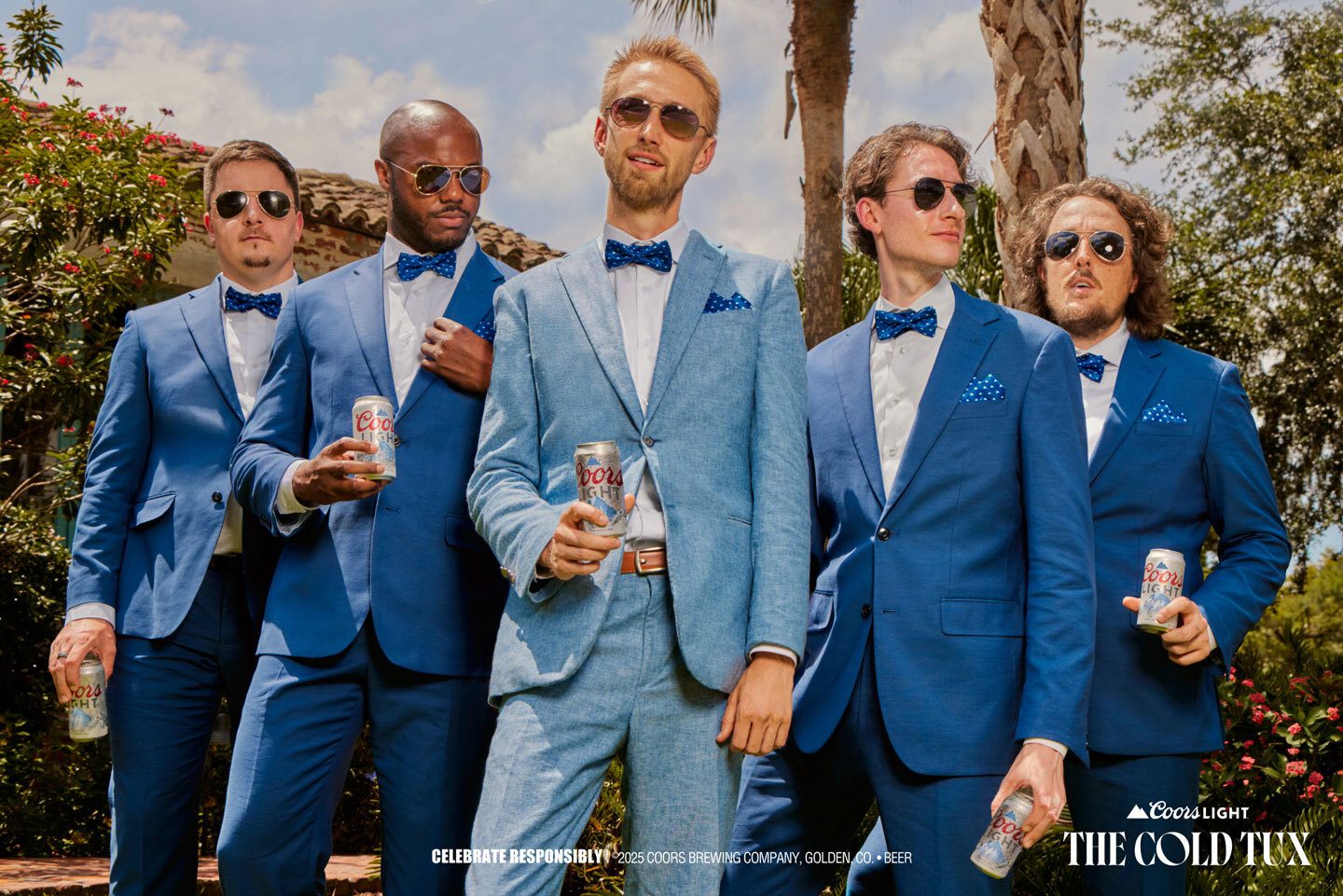 Five men in blue suits holding Coors Light cans, advertising "The Cold Tux" campaign.