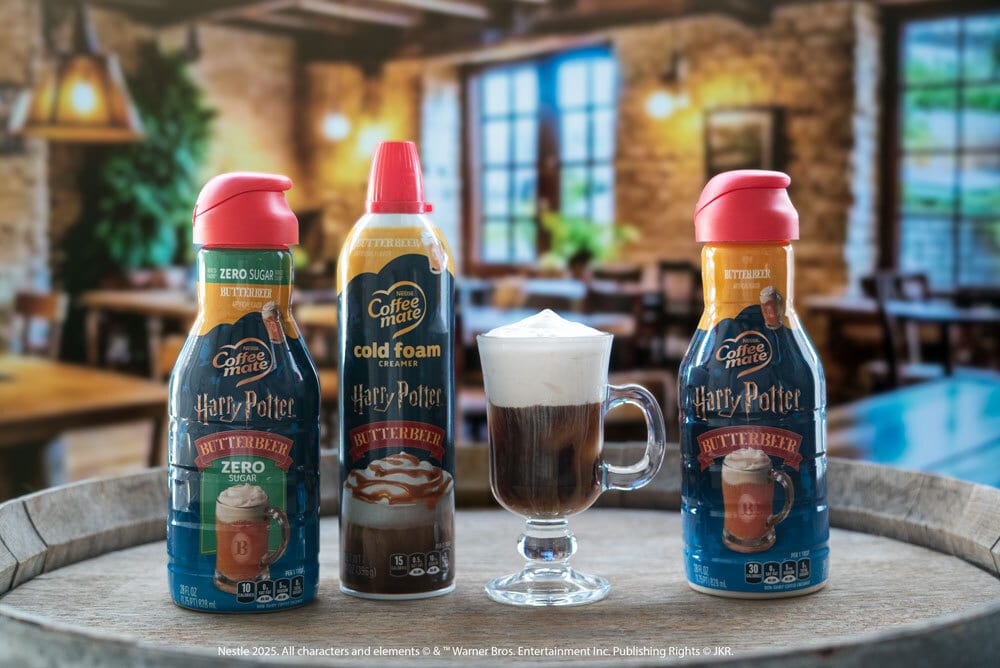 Coffee-mate Harry Potter Butterbeer creamers, cold foam, and a coffee drink on a barrel.