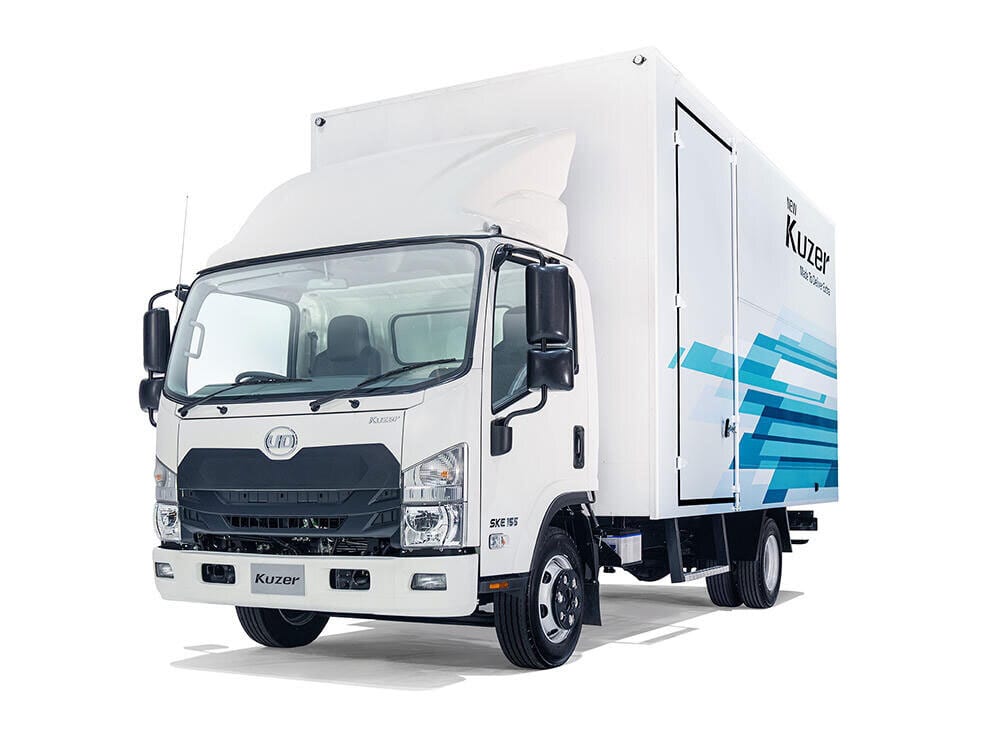 White UD KuzeR box truck with blue graphics on the cargo area, angled front view.