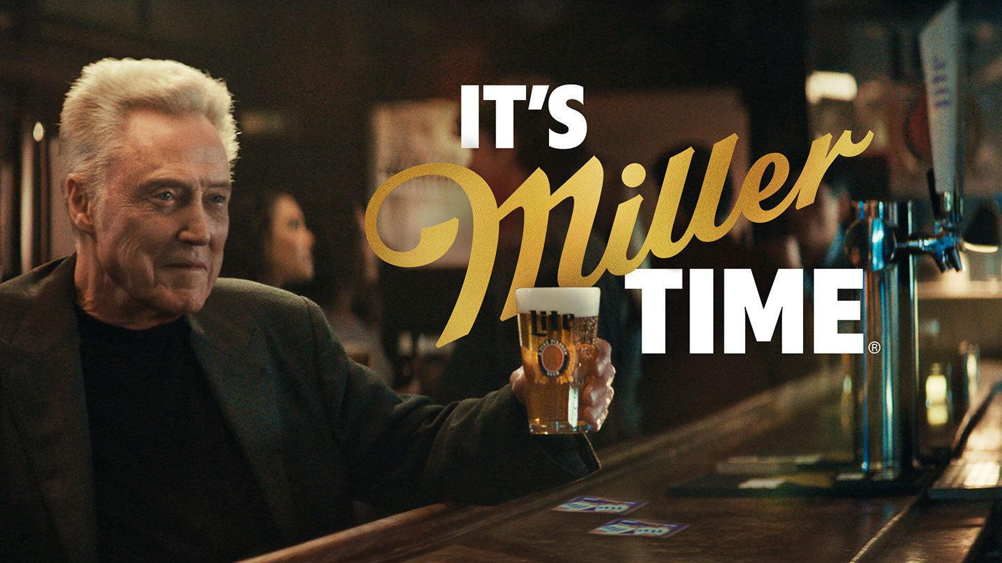 Christopher Walken holds a Miller Lite beer in a bar with "IT'S Miller TIME" text.
