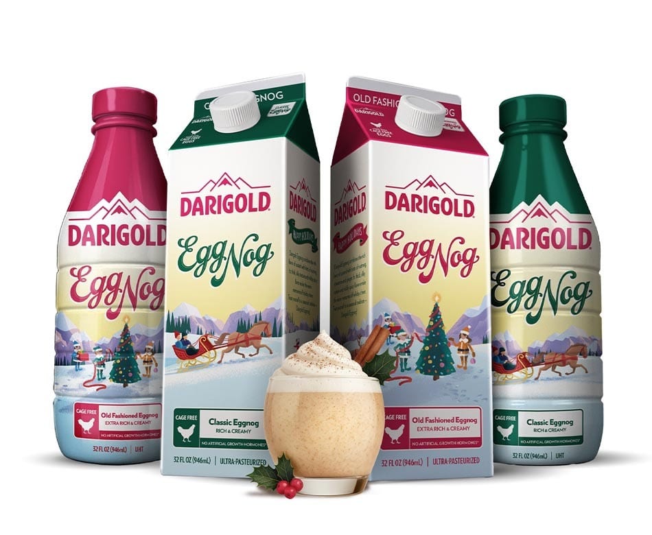 Darigold Egg Nog in diverse packaging and a glass, against a festive winter landscape.