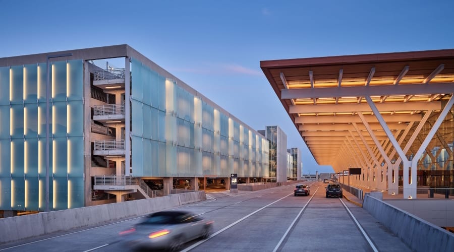 Urban design, Sky, Car, Building, Vehicle, Infrastructure, Wheel, Tire, Asphalt