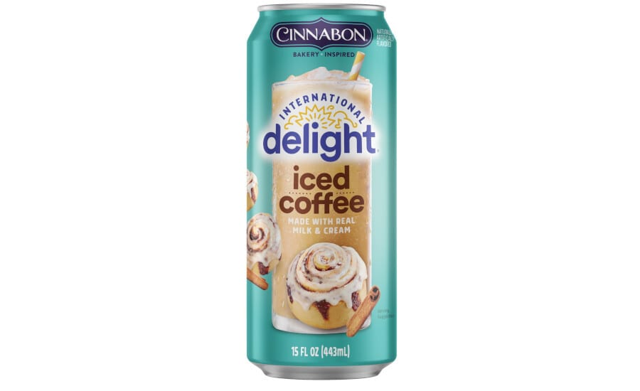 Teal can of Cinnabon International Delight Iced Coffee with cinnamon rolls.