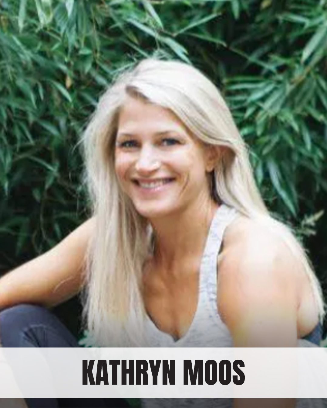 Smiling blonde woman Kathryn Moos against a green leafy background.