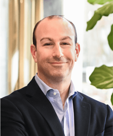 Smiling man in a suit.