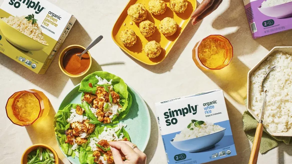 Overhead shot of Simply So organic brown and white jasmine rice, lettuce wraps, and rice balls.