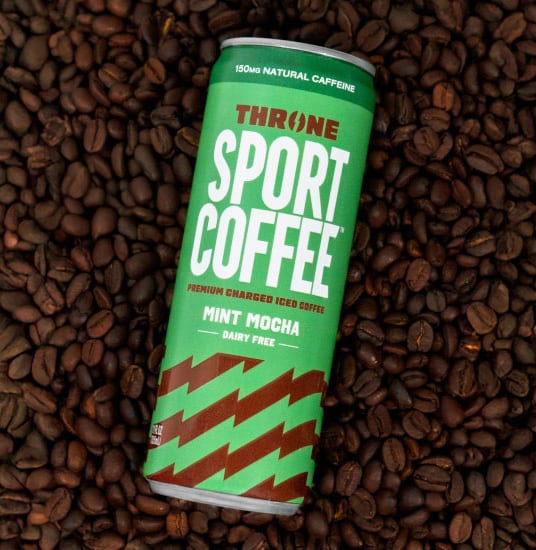 Throne Sport Coffee Mint Mocha can on coffee beans.