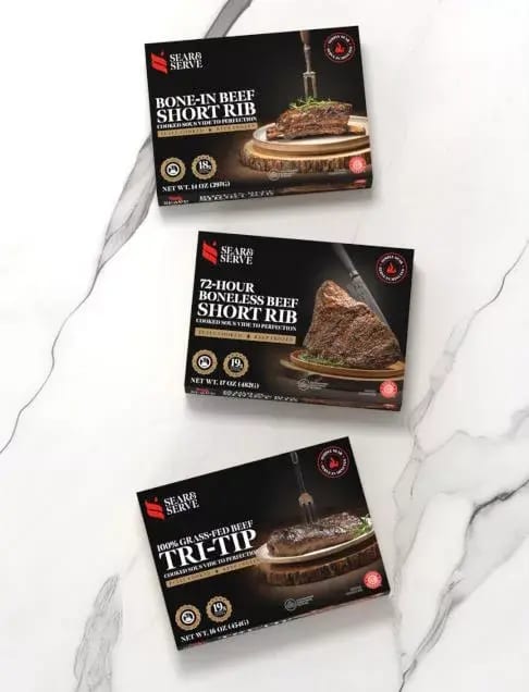 Three black boxes of Sear & Serve beef products: Bone-in, Boneless Short Rib, and Tri-Tip.
