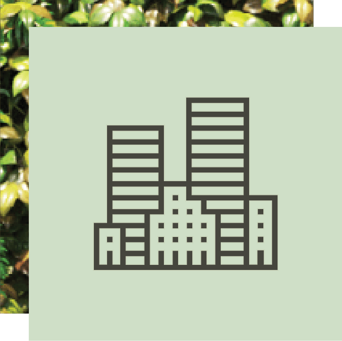 Icon of a cityscape with multiple buildings on a light green background, partially covered by foliage.
