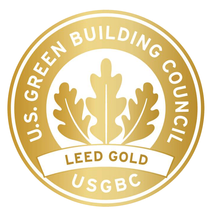 Gold circular logo for U.S. Green Building Council, indicating LEED Gold certification, with oak leaves.