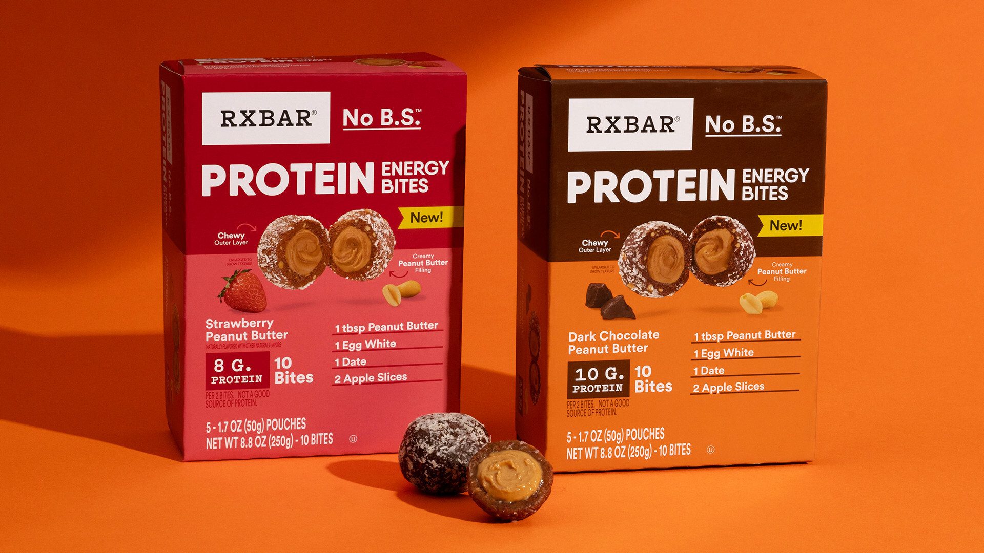 Two RXBAR Protein Energy Bites boxes: Strawberry Peanut Butter and Dark Chocolate Peanut Butter.