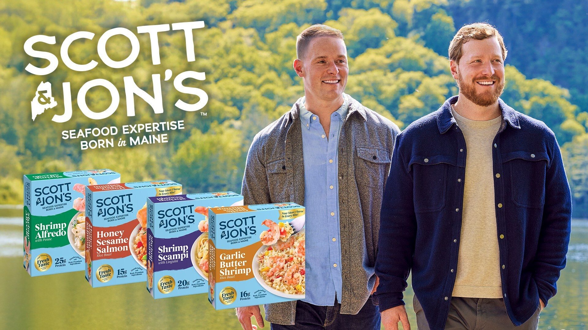 Scott & Jon, the founders, stand with their lineup of frozen seafood meals like Shrimp Alfredo.