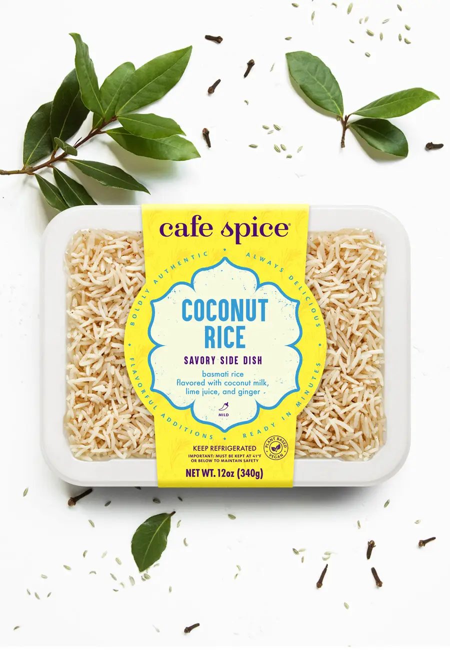Cafe Spice Coconut Rice savory side dish, basmati rice with coconut milk, lime, and ginger, surrounded by spices.