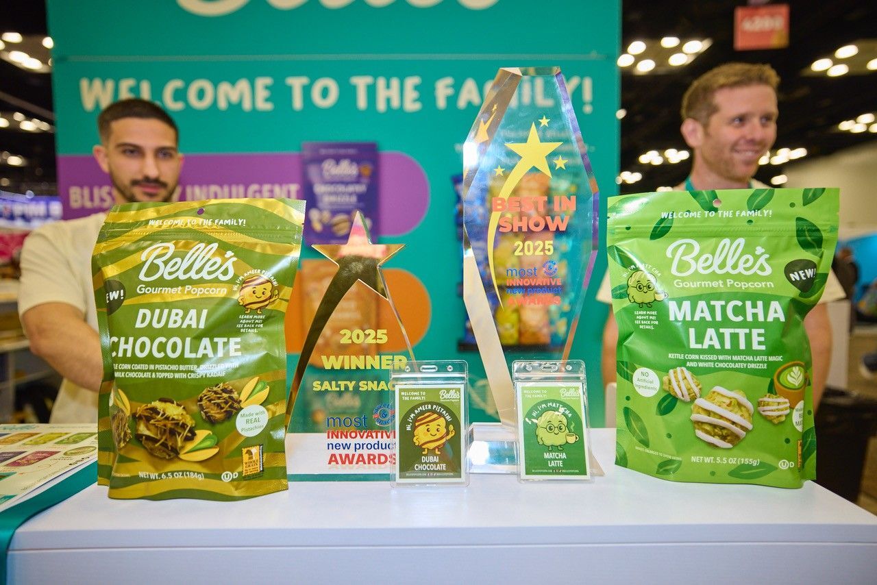 Belle's popcorn bags (Dubai Chocolate, Matcha Latte) with 2025 Best in Show & Winner awards.