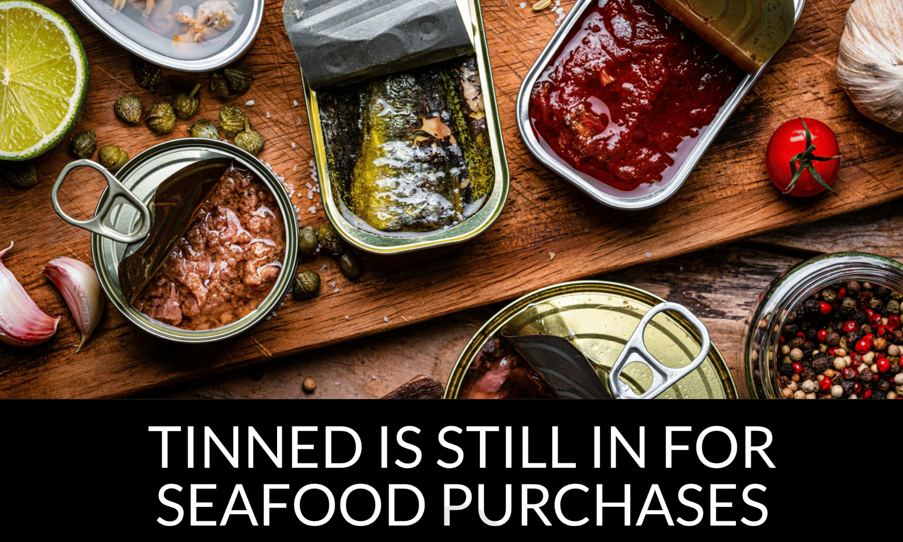 Open tins of various seafood with fresh ingredients and spices on a wooden board.