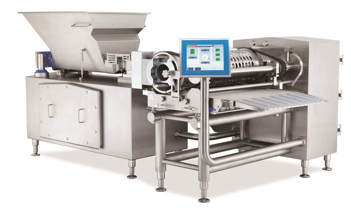 Industrial stainless steel food processing machine with a hopper, conveyor, and digital control screen.