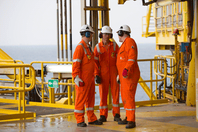 Hard hat, High-visibility clothing, Workwear, Helmet, Sky, Engineer, Tradesman, Yellow, Sleeve