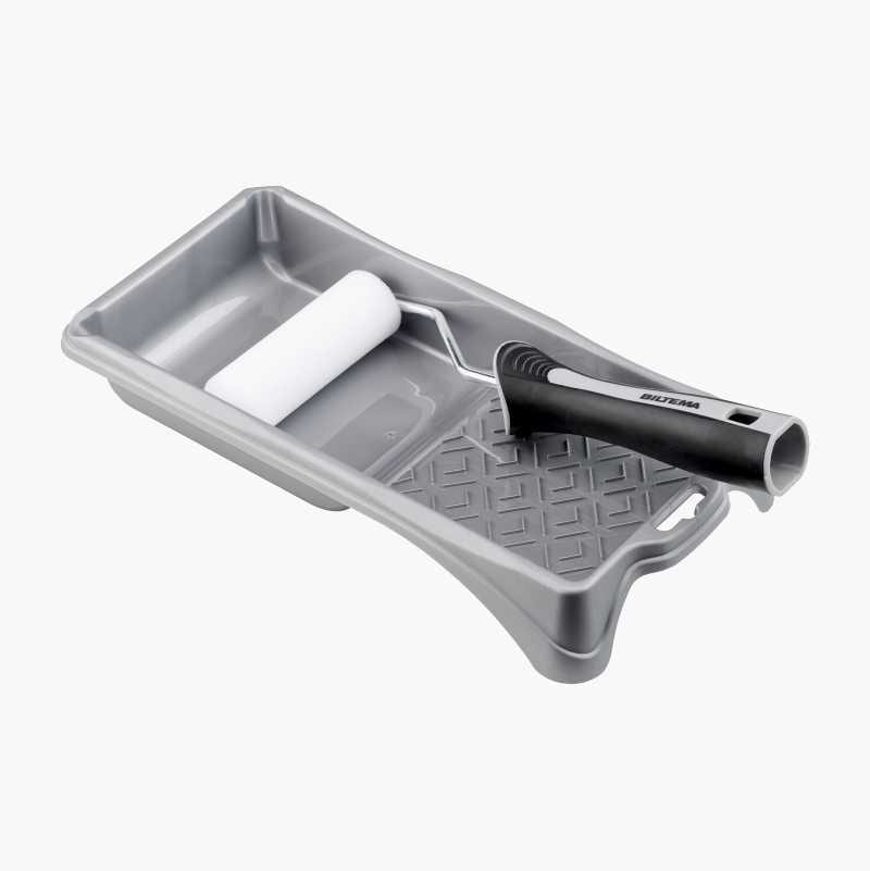 A gray paint tray with a white roller and black handle, presented on a light background from an elevated angle.