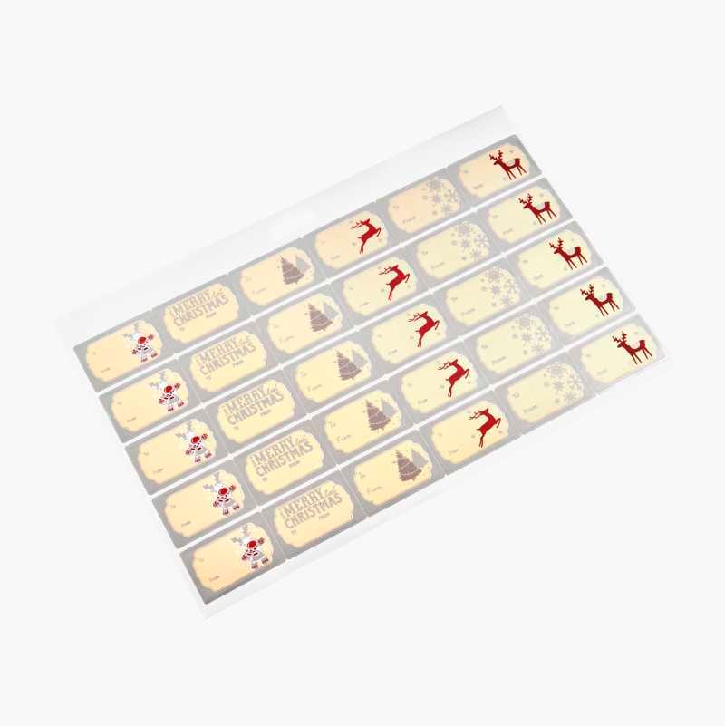 Sheet of Christmas gift tags with red reindeers, trees, snowflakes, and "Merry Christmas" text.