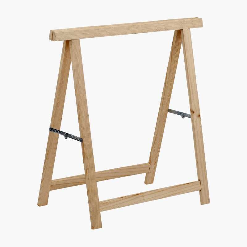 A light-colored wooden sawhorse, featuring an A-frame design with horizontal top and bottom supports.