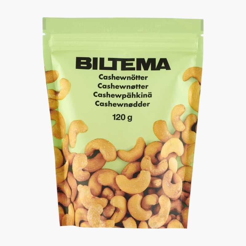 Light green Biltema pouch filled with 120g of roasted cashew nuts, with text in multiple languages.
