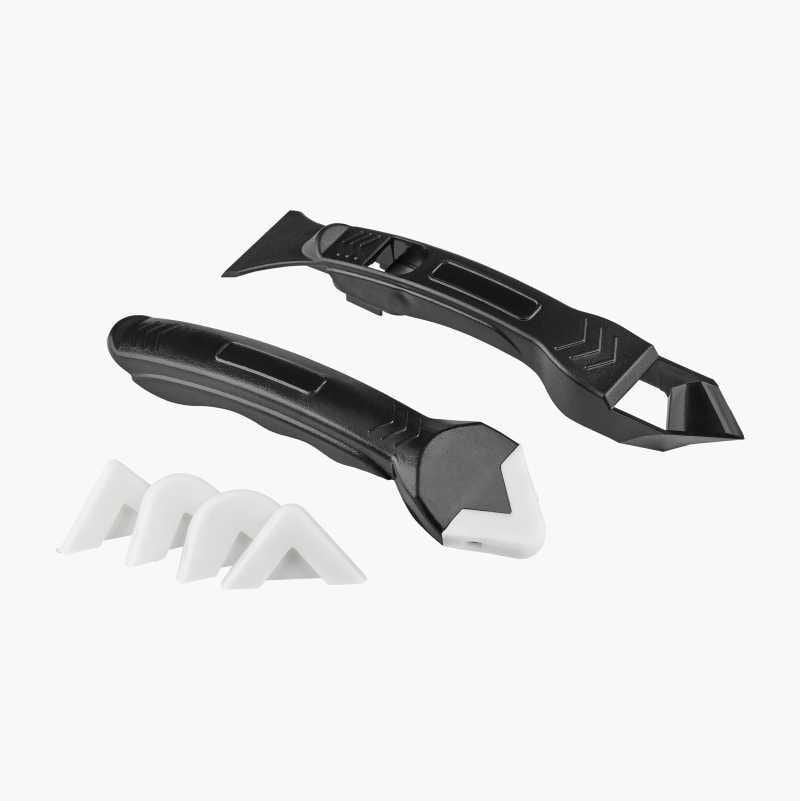 Set of black sealant tools with white silicone tips for precise caulking and gap filling.