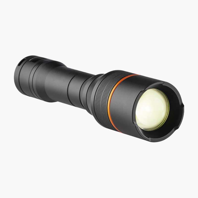 Black flashlight with an orange ring and yellowish lens.