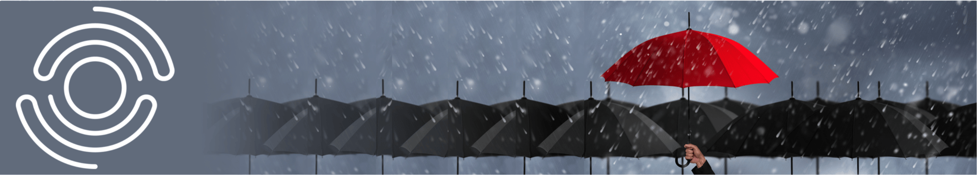 A vibrant red umbrella stands out among a row of black umbrellas in the rain, held by a hand. A logo is visible on the left.