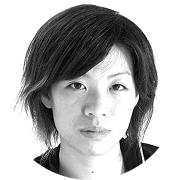 Black and white headshot of an Asian woman with short, dark hair looking directly forward.