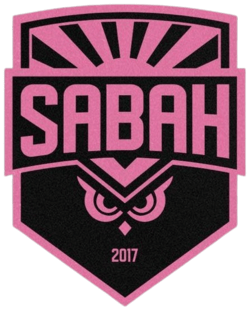 Pink and black shield logo for 'SABAH 2017' featuring an owl and sun rays.